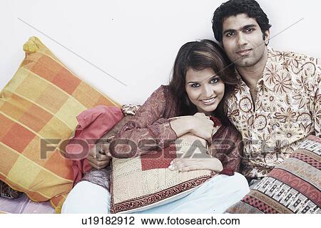 Portrait of a young couple smiling View Large Photo Image Stock Image - Portrait of a young couple smiling. Fotosearch