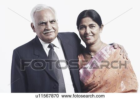 Close-up of a mature couple smiling View Large Photo Image Stock Image - Close-up of a mature couple smiling. Fotosearch