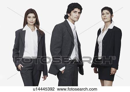 Portrait of a businessman and two businesswomen standing View Large Photo Image Stock Image - Portrait of a businessman and two businesswomen standing. Fotosearch