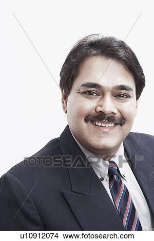 Portrait of a businessman smiling View Large Photo Image Picture - Portrait of a businessman smiling. Fotosearch