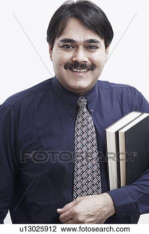 Portrait of a businessman smiling View Large Photo Image Stock Image - Portrait of a businessman smiling. Fotosearch