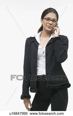 Portrait of a businesswoman talking on a mobile phone View Large Photo Image Stock Photography - Portrait of a businesswoman talking on a mobile phone. Fotosearch