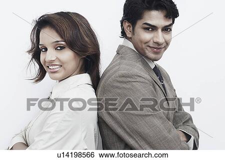 Side profile of a businessman and a businesswoman back to back View Large Photo Image Stock Photograph - Side profile of a businessman and a businesswoman back to back. Fotosearch