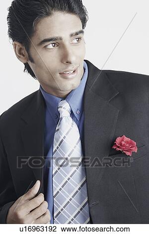 Young man wearing a suit View Large Photo Image Stock Image - Young man wearing a suit. Fotosearch