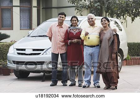 Portrait of a mature couple and their two children View Large Photo Image Picture - Portrait of a mature couple and their two children. Fotosearch