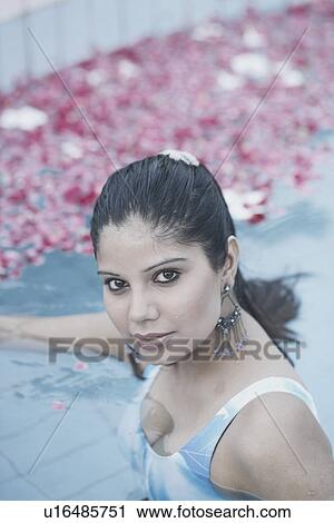 Portrait of a young woman in a swimming pool View Large Photo Image Stock Image - Portrait of a young woman in a swimming pool. Fotosearch