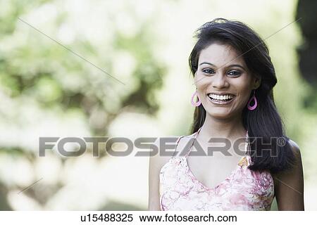 Stock Photography - Portrait of a young woman smiling. Fotosearch