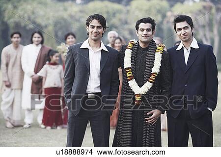 Portrait of three young men smiling View Large Photo Image Picture - Portrait of three young men smiling. Fotosearch