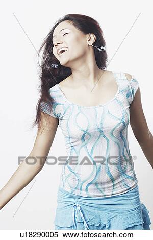 Close-up of a young woman with her arms outstretched View Large Photo Image Stock Photography - Close-up of a young woman with her arms outstretched. Fotosearch