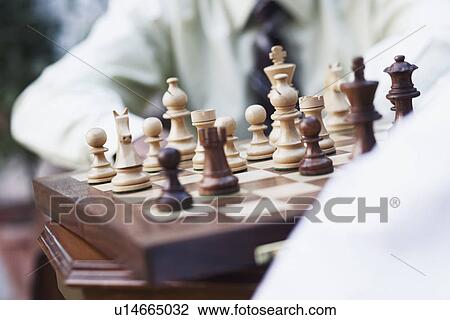 Mid section view of two businessmen playing chess View Large Photo Image Stock Image - Mid section view of two businessmen playing chess. Fotosearch
