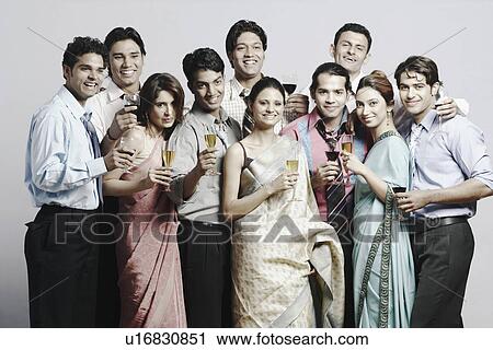 Stock Image - Portrait of a group of people holding drinks. Fotosearch