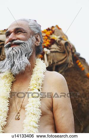Close-up of a priest smiling View Large Photo Image Stock Photograph - Close-up of a priest smiling. Fotosearch