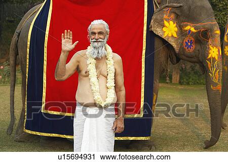Portrait of a priest greeting View Large Photo Image Stock Image - Portrait of a priest greeting. Fotosearch