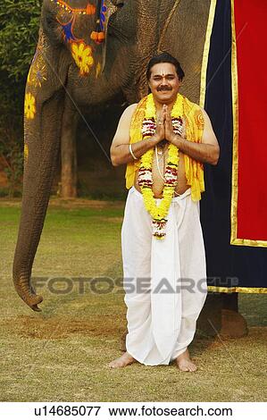 Stock Photo - Portrait of a priest greeting. Fotosearch