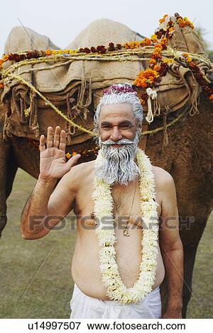 Stock Photo - Portrait of a priest greeting. Fotosearch