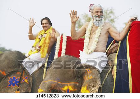 Portrait of two priests riding elephants View Large Photo Image Stock Image - Portrait of two priests riding elephants. Fotosearch