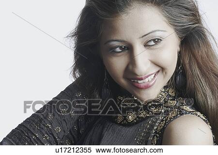 Close-up of a young woman smiling View Large Photo Image Stock Photography - Close-up of a young woman smiling. Fotosearch