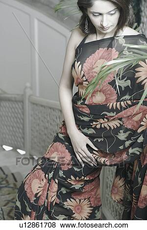 Stock Photo - High angle view of a young woman. Fotosearch