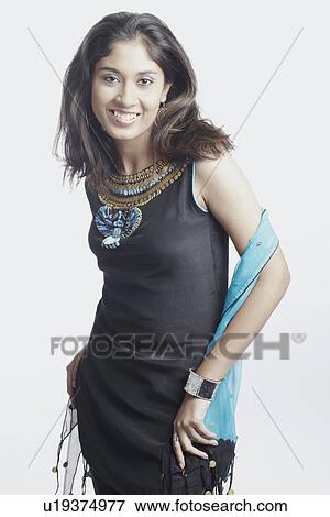 Portrait of a young woman smiling View Large Photo Image Stock Photo - Portrait of a young woman smiling. Fotosearch