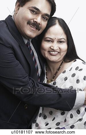 Stock Photo - Portrait of a mature man embracing a mature woman. Fotosearch