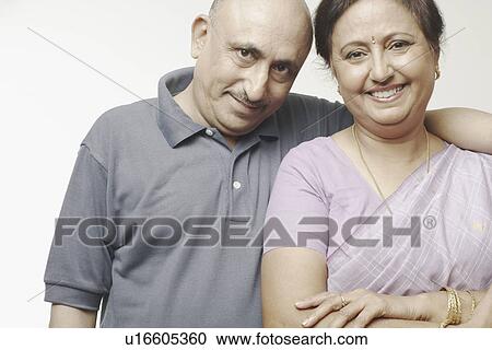 Stock Image - Portrait of a mature couple smiling. Fotosearch