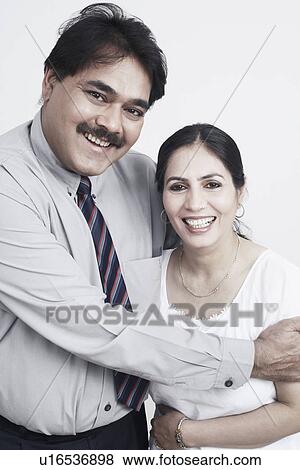 Stock Photo - Portrait of a mature man embracing a mature woman. Fotosearch