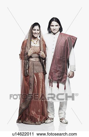 Stock Image - Portrait of a newlywed couple smiling. Fotosearch