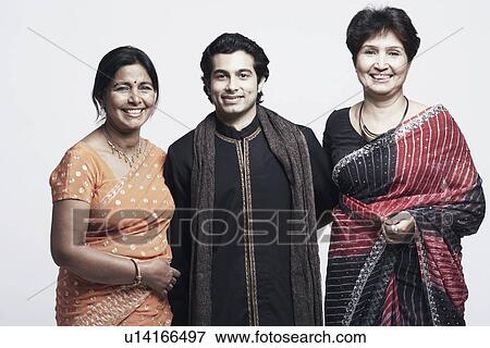 Stock Photo - Portrait of a young man and two mature women smiling. Fotosearch