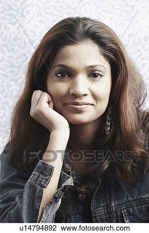 Portrait of a young woman smiling View Large Photo Image Stock Image - Portrait of a young woman smiling. Fotosearch