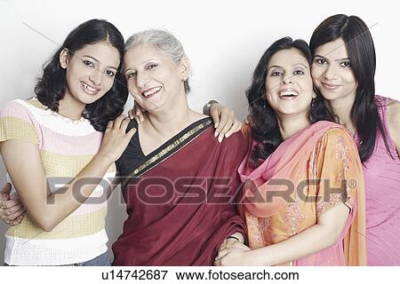 Stock Photo - Portrait of four women standing. Fotosearch