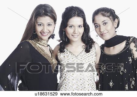 Stock Photo - Portrait of three young women smiling. Fotosearch