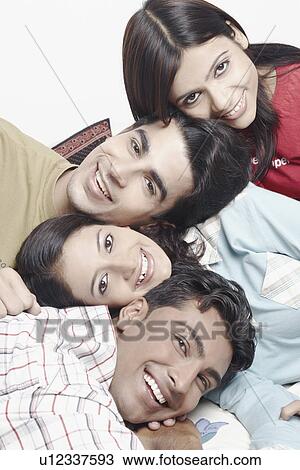 Portrait of two young men and two young women View Large Photo Image Stock Image - Portrait of two young men and two young women. Fotosearch