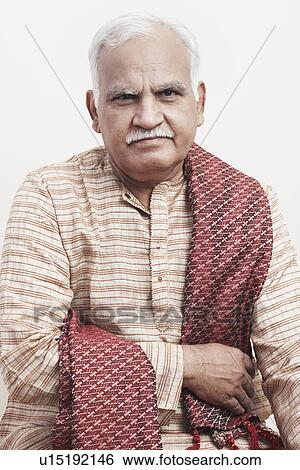 Stock Photograph - Portrait of a mature man wearing traditional clothing. Fotosearch