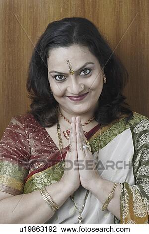 Portrait of a mature woman in a prayer position View Large Photo Image Stock Image - Portrait of a mature woman in a prayer position. Fotosearch