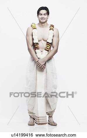 Portrait of a young man in traditional clothing wearing a garland View Large Photo Image Stock Photograph - Portrait of a young man in traditional clothing wearing a garland. Fotosearch