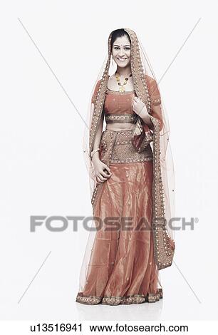 Portrait of a young woman in traditional clothing smiling View Large Photo Image Stock Image - Portrait of a young woman in traditional clothing smiling. Fotosearch