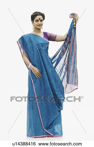 Stock Photograph - Portrait of a young woman wearing a sari. Fotosearch