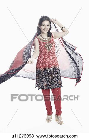 Portrait of a young woman with a stole in her hand posing View Large Photo Image Stock Photo - Portrait of a young woman with a stole in her hand posing. Fotosearch