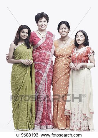 Stock Image - Portrait of two mothers standing with their daughters. Fotosearch
