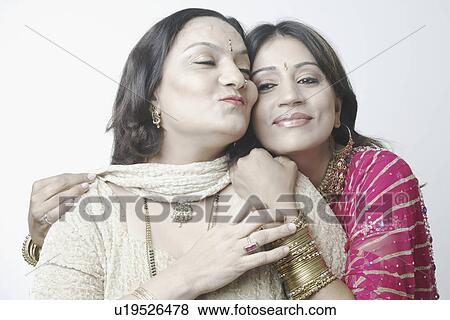 Close-up of a mid adult woman and a mature woman smiling View Large Photo Image Stock Photo - Close-up of a mid adult woman and a mature woman smiling. Fotosearch
