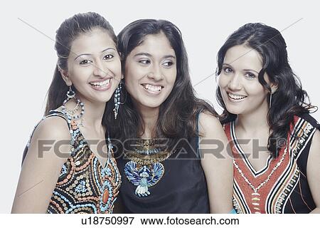 Close-up of three young women smiling View Large Photo Image Stock Photo - Close-up of three young women smiling. Fotosearch