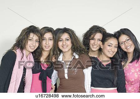 Stock Photo - Portrait of a group of young women smiling. Fotosearch