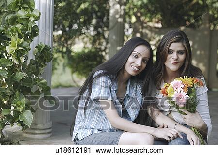 Portrait of a teenage girl a young woman sitting View Large Photo Image Stock Image - Portrait of a teenage girl a young woman sitting. Fotosearch