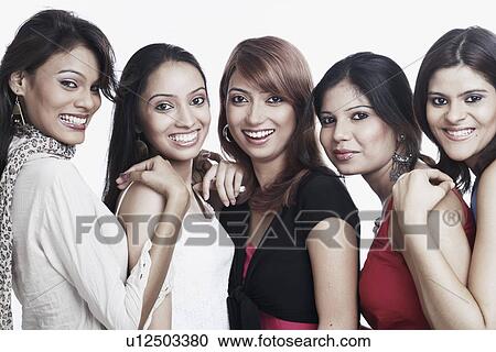 Portrait of four young women and a teenage girl smiling View Large Photo Image Stock Image - Portrait of four young women and a teenage girl smiling. Fotosearch