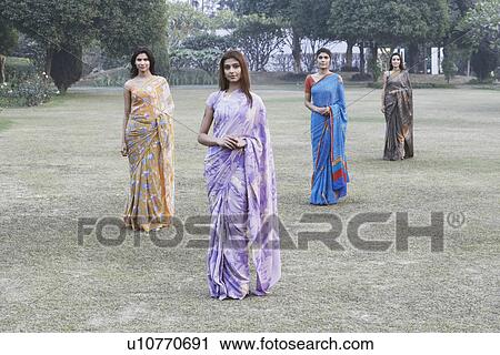 Portrait of four young women posing View Large Photo Image Stock Image - Portrait of four young women posing. Fotosearch