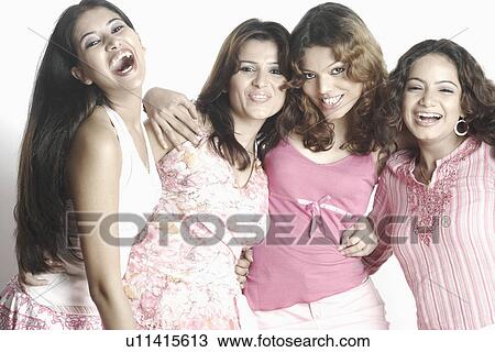 Portrait of four young women smiling View Large Photo Image Stock Image - Portrait of four young women smiling. Fotosearch
