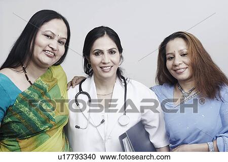 Stock Image - Portrait of three women smiling. Fotosearch