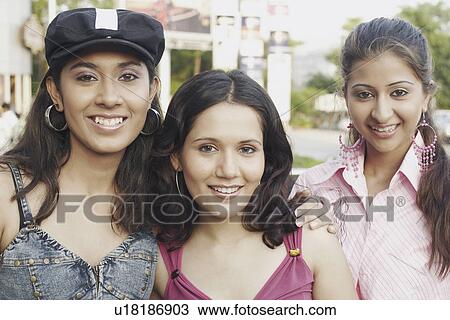 Portrait of three young women smiling View Large Photo Image Stock Image - Portrait of three young women smiling. Fotosearch