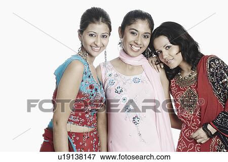 Stock Photo - Portrait of three young women smiling. Fotosearch