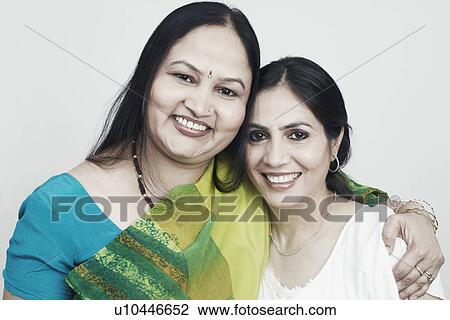 Portrait of two mature women holding each other View Large Photo Image Stock Image - Portrait of two mature women holding each other. Fotosearch